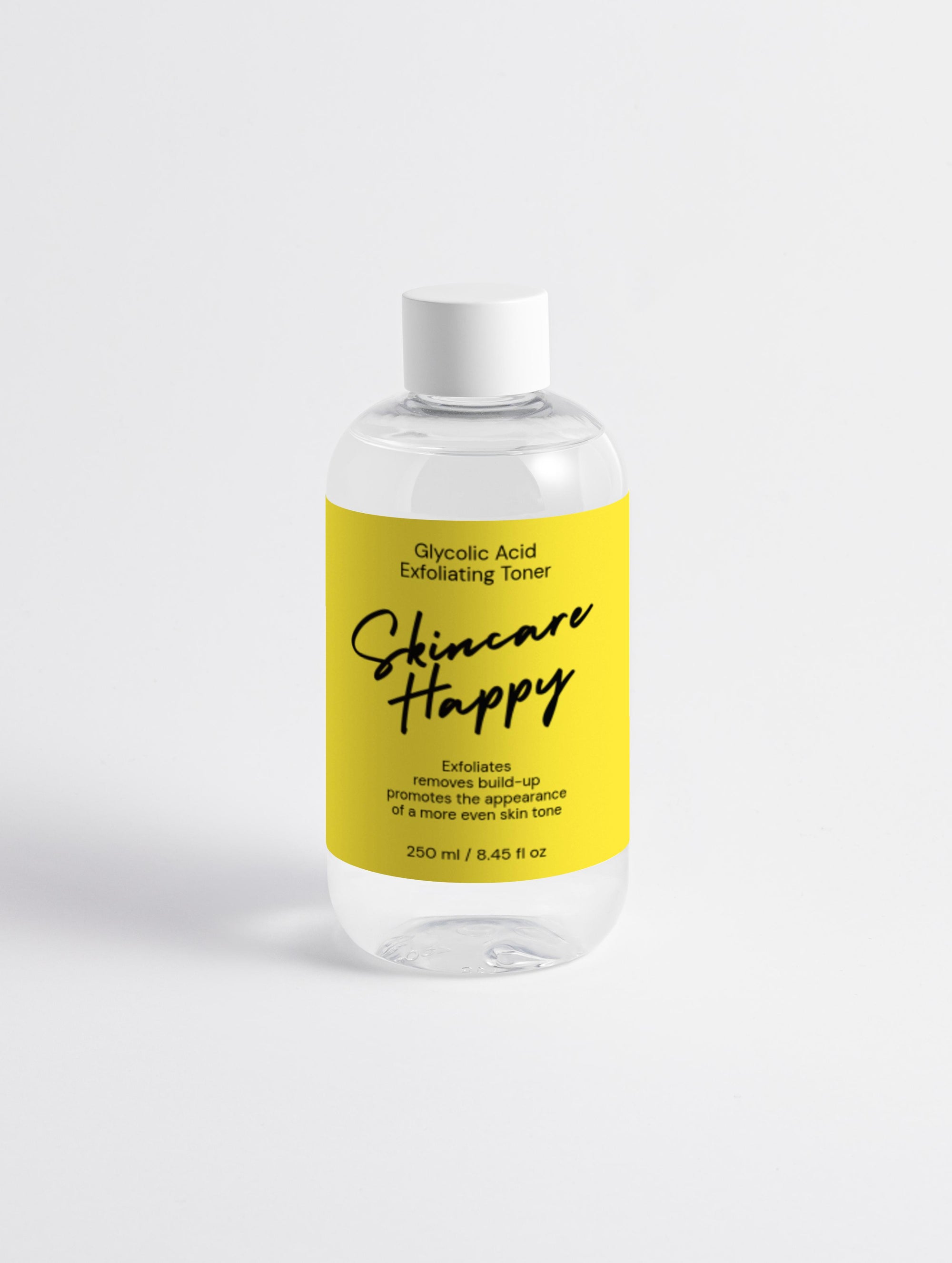 Skincare Happy toner bottle with yellow label on a white background