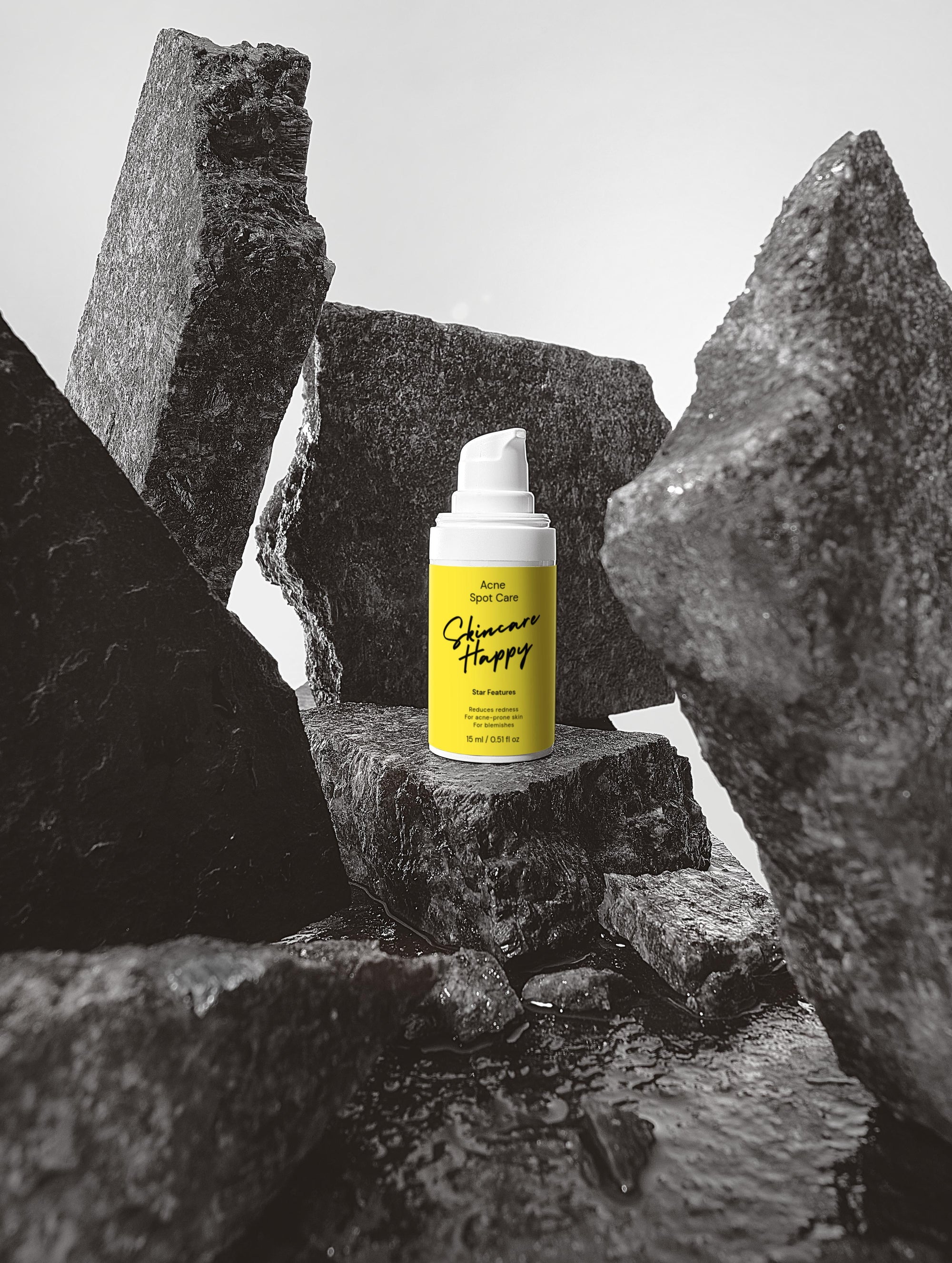 Yellow bottle with black text on a gray stone background