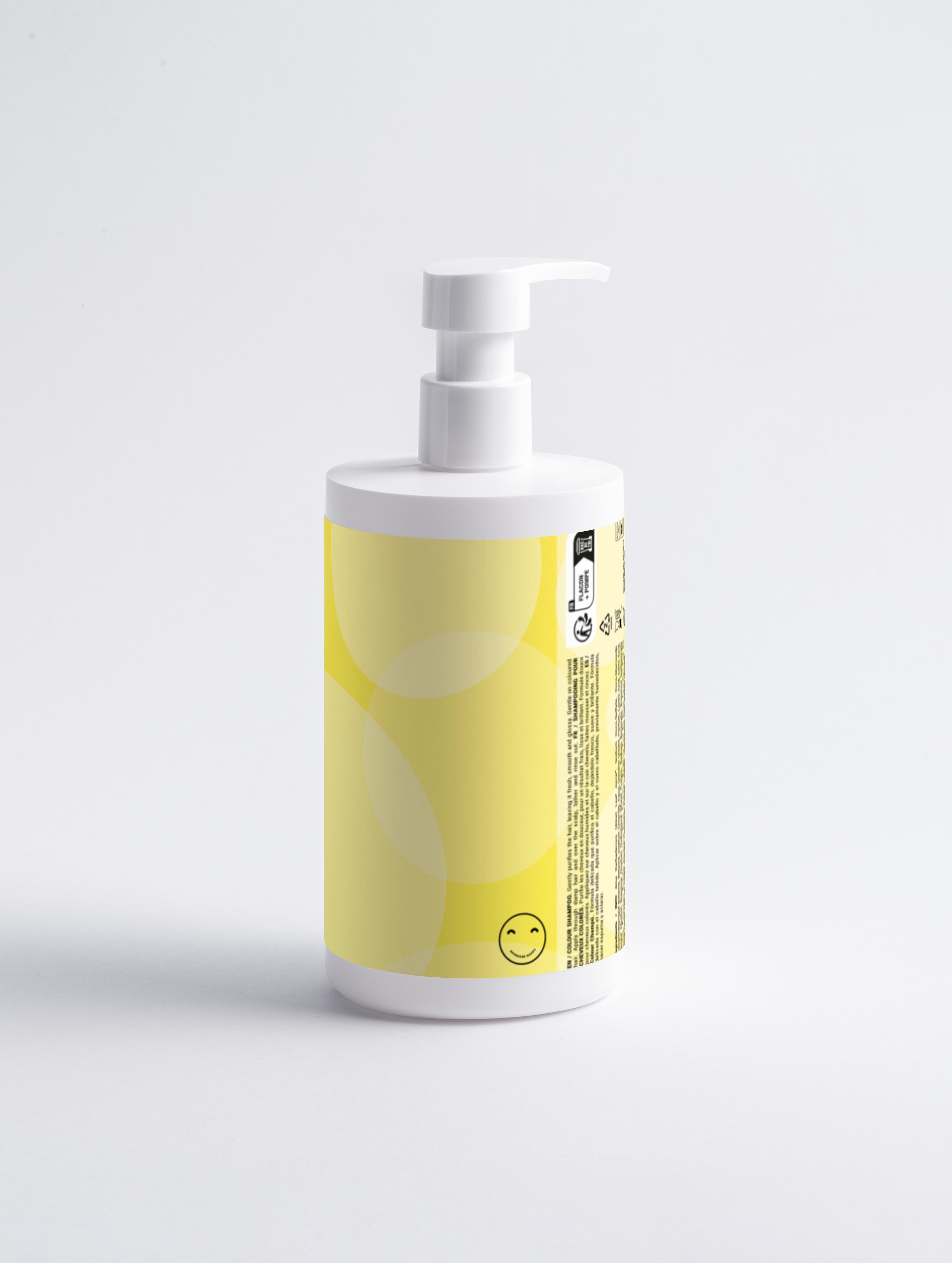 White bottle with a yellow label featuring a smiley face on a light gray background