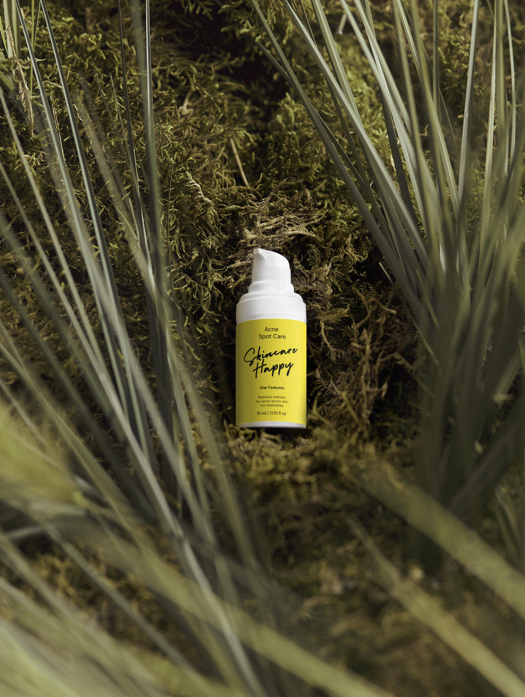 Yellow bottle with white cap on a green leafy background