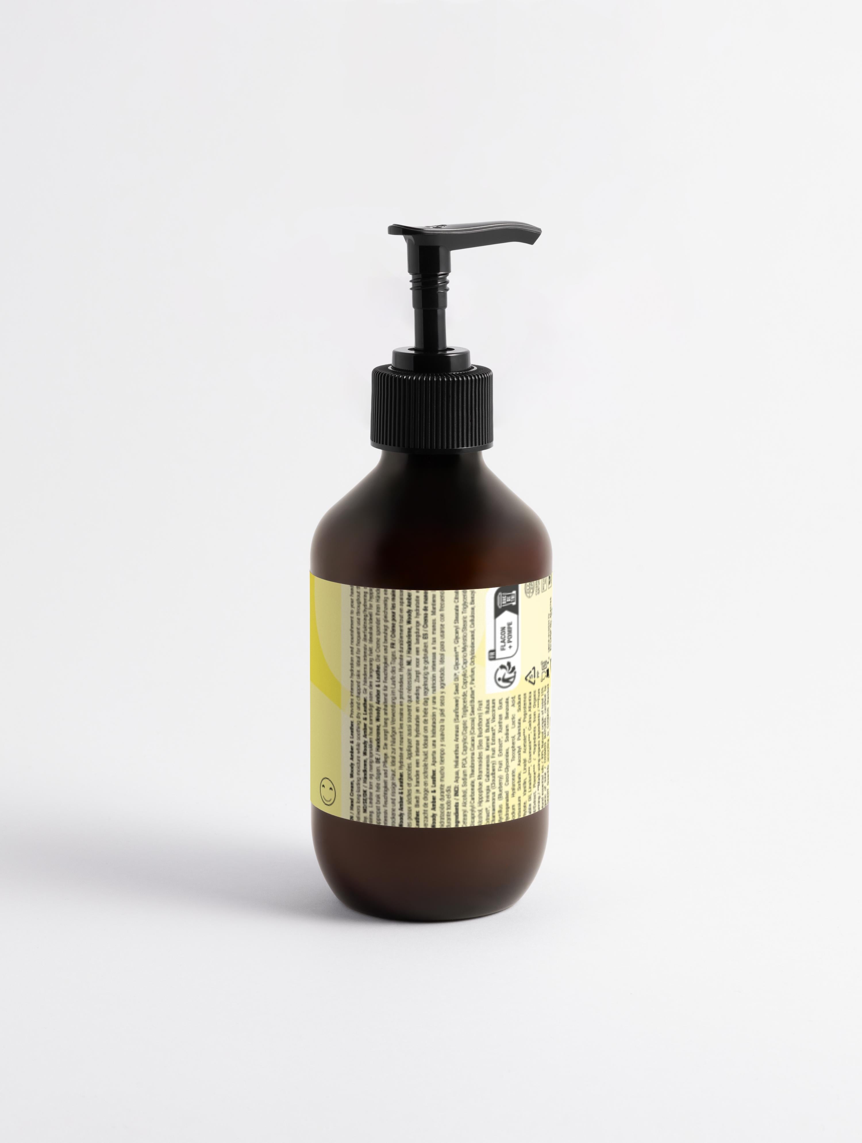 Brown bottle with pump and label on a white background