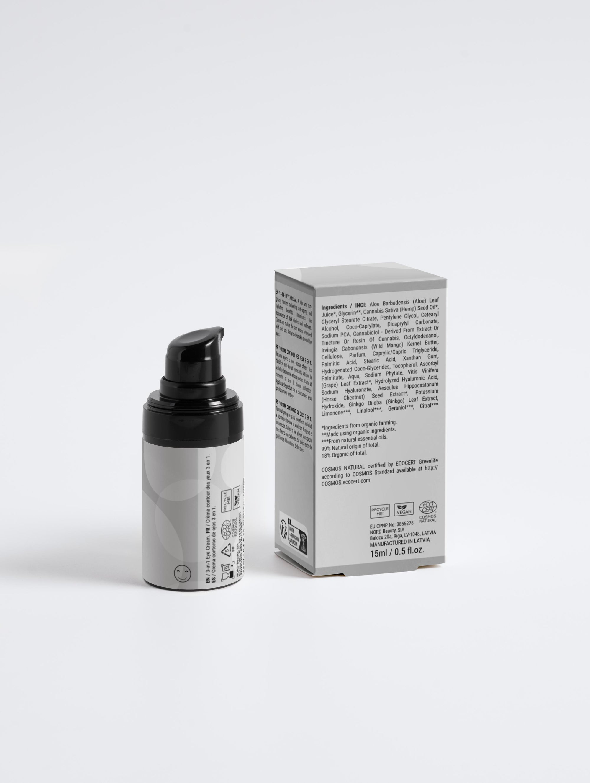 Skincare bottle with pump and packaging on a white background