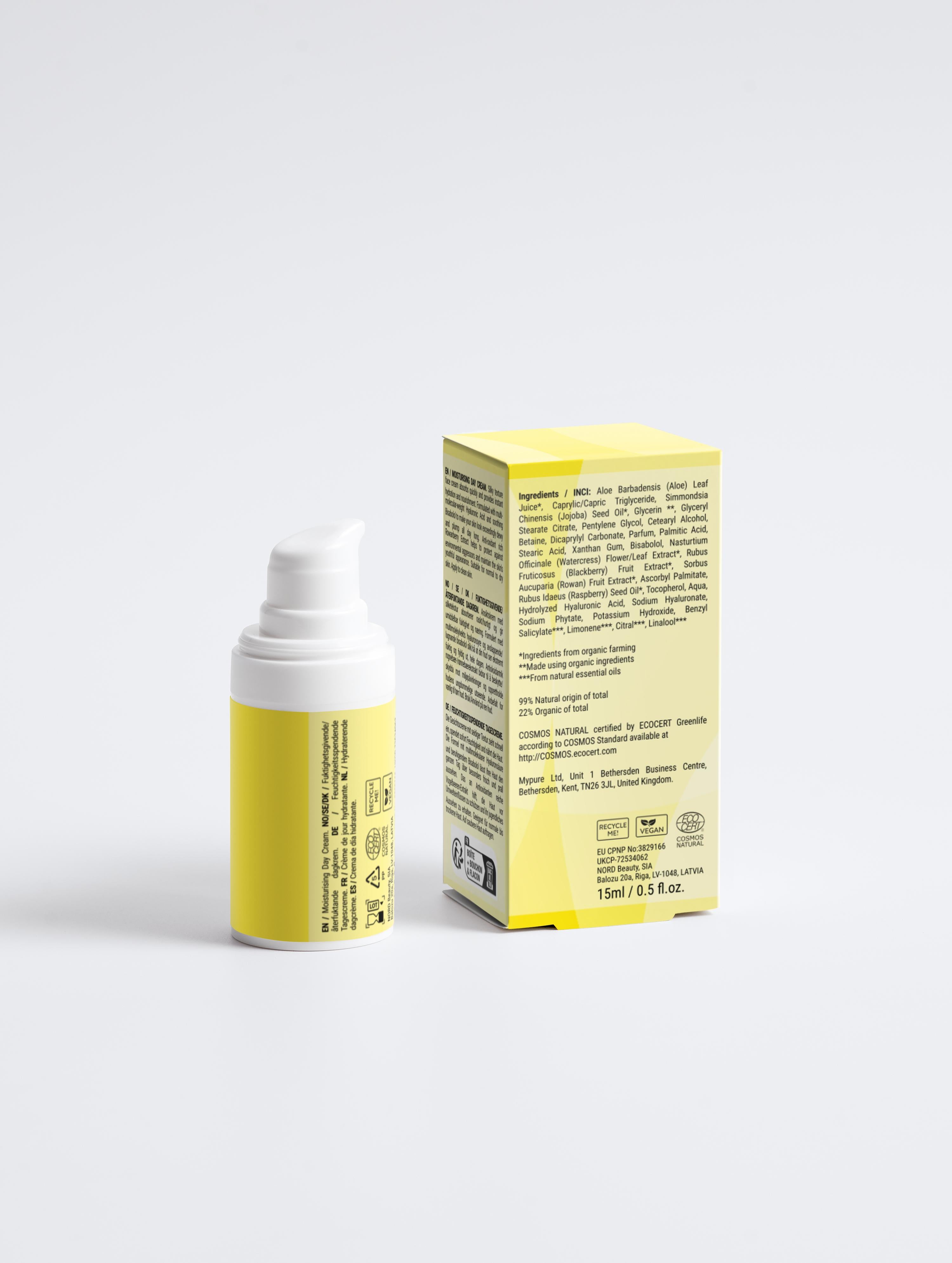 Yellow skincare product with white cap and box on a light gray background
