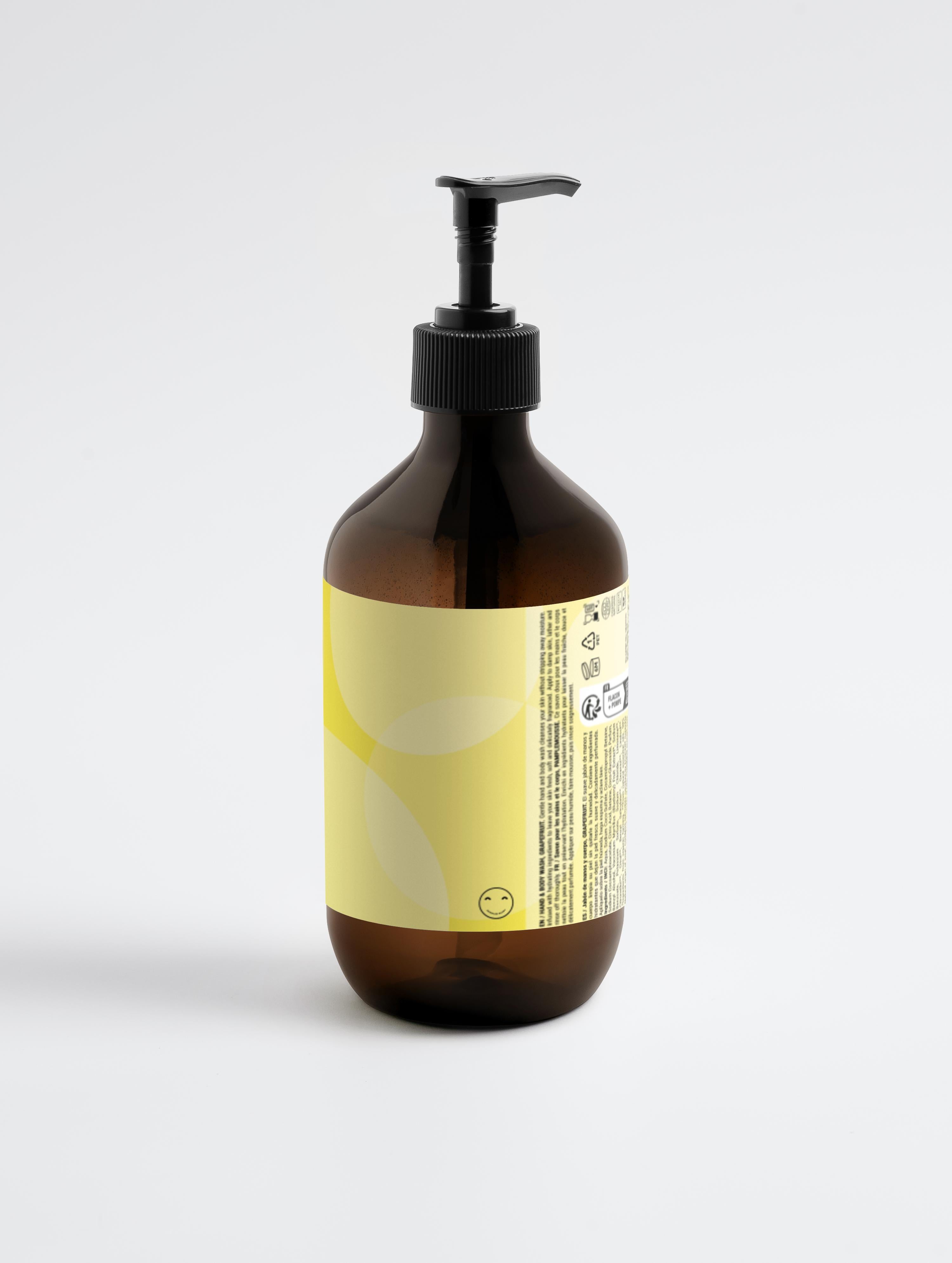 Brown bottle with pump and yellow label on a light gray background
