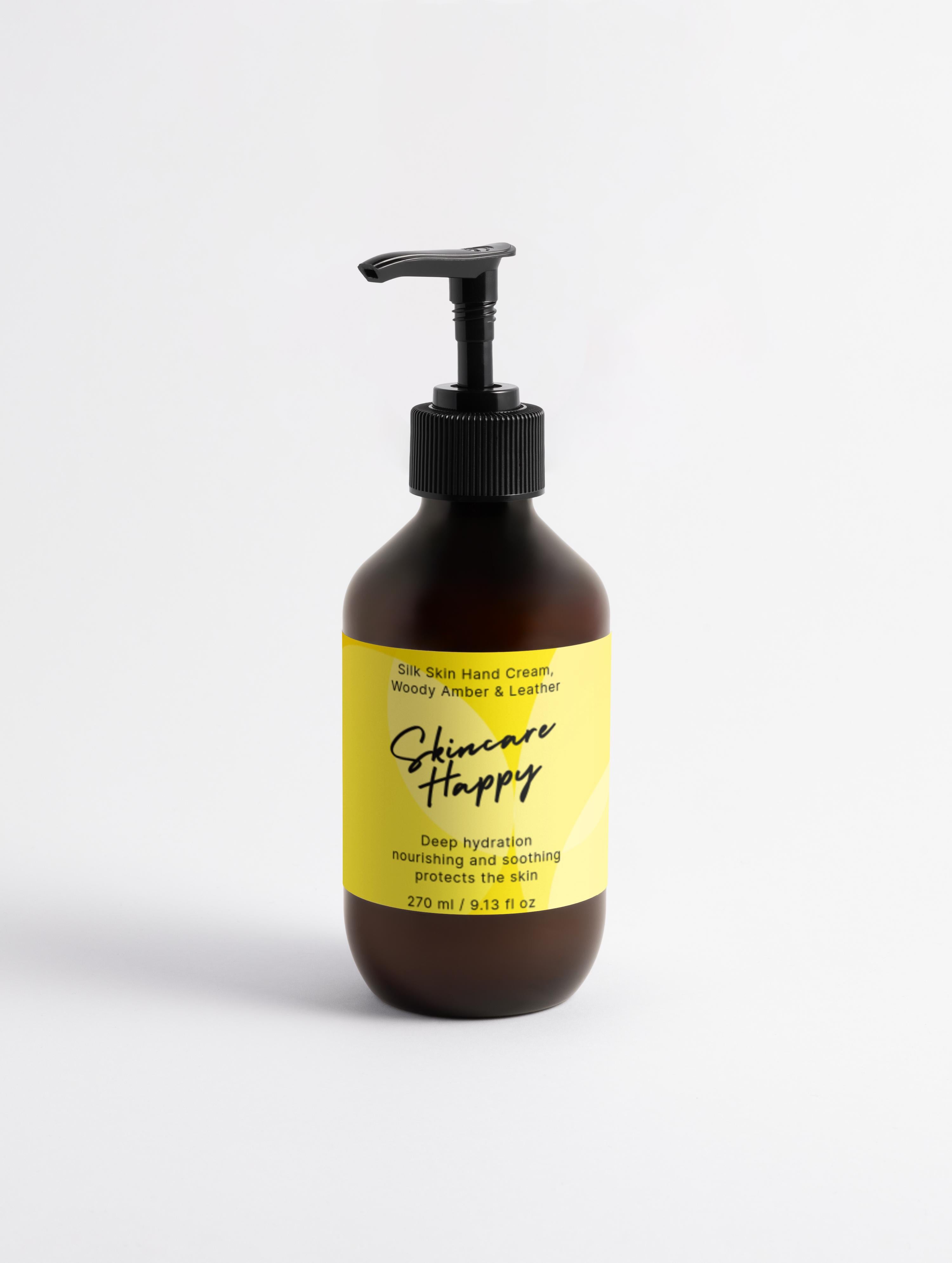 Hand cream bottle with pump and yellow label on a white background