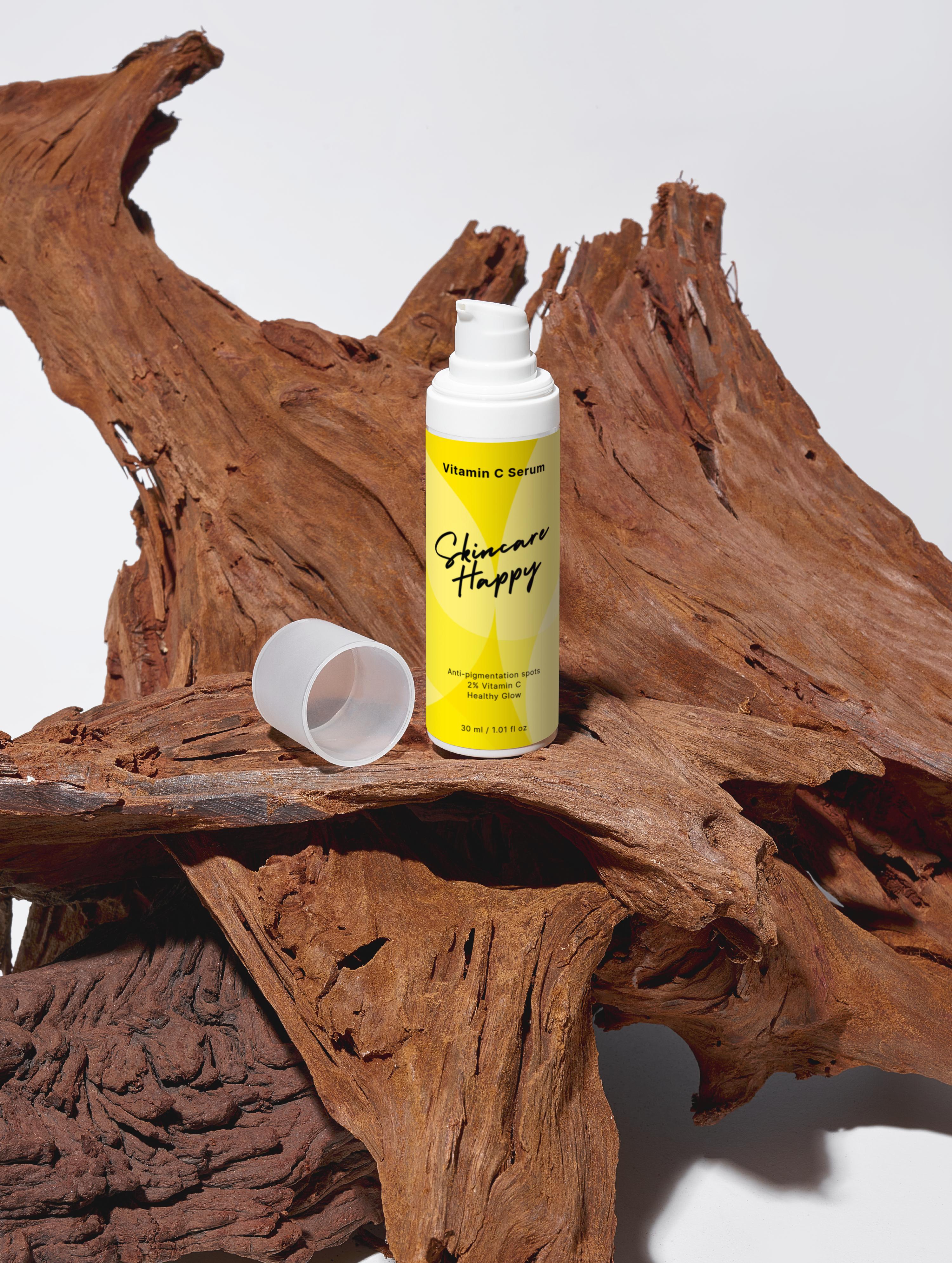 Skincare product bottle with yellow label on a wooden surface