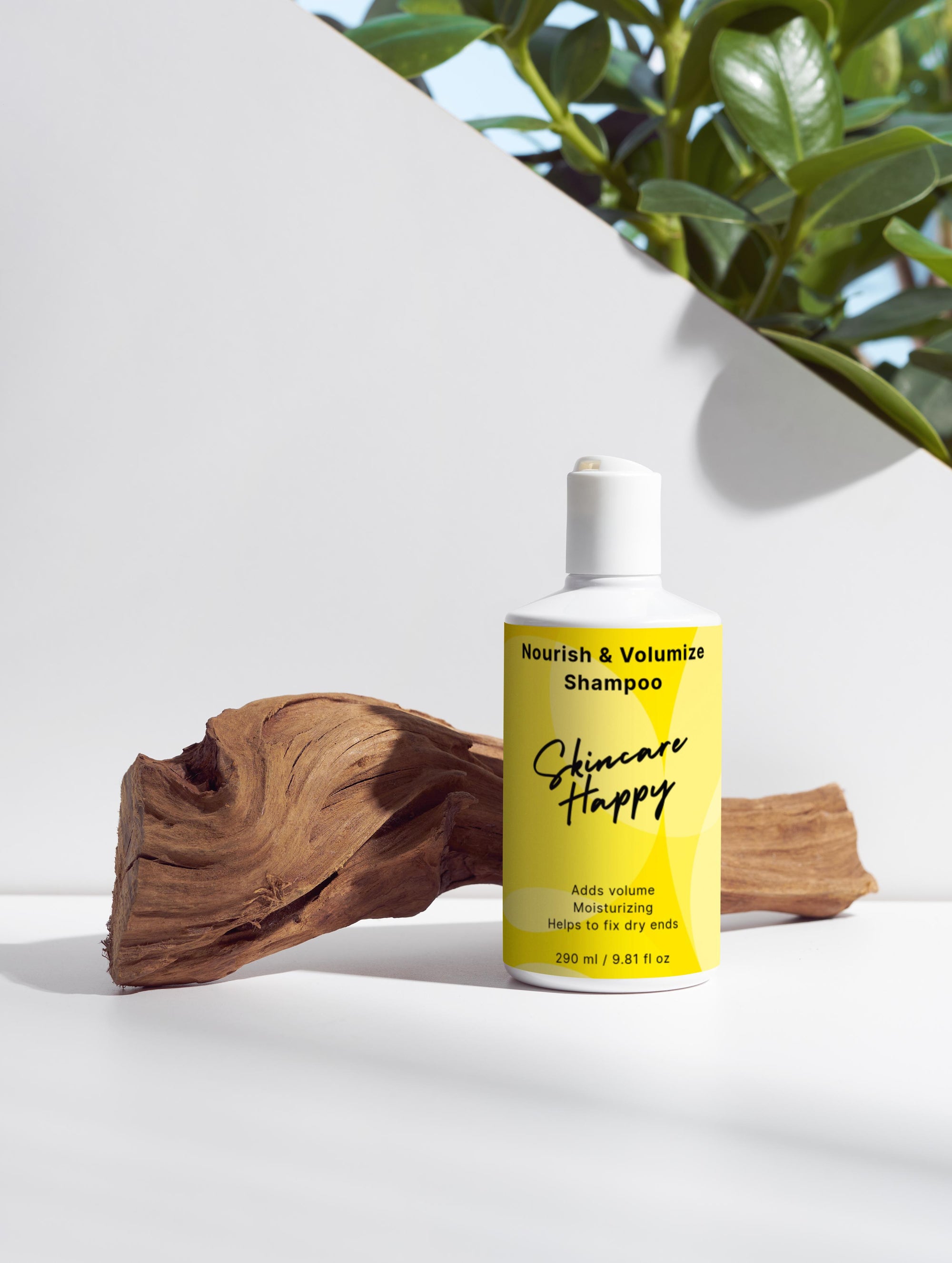 Shampoo bottle labeled 'Nourish & Volumize' by 'Skincare Happy' on a white surface with a wooden log and plant in the background.