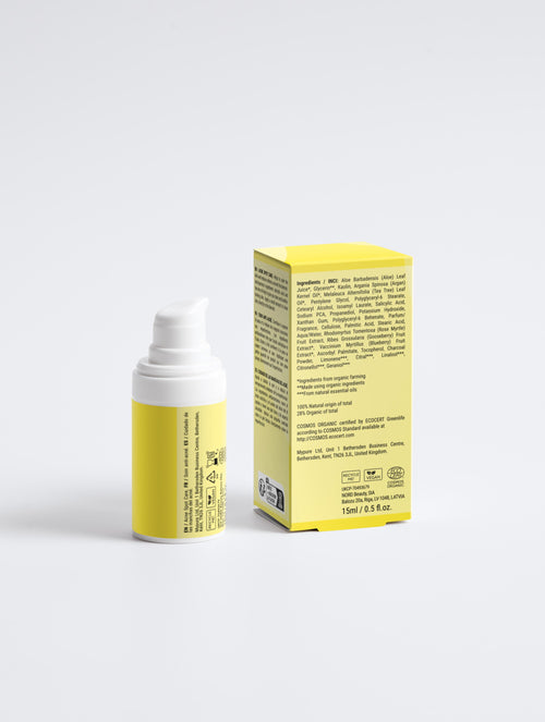 Yellow skincare product bottle and box on a white background