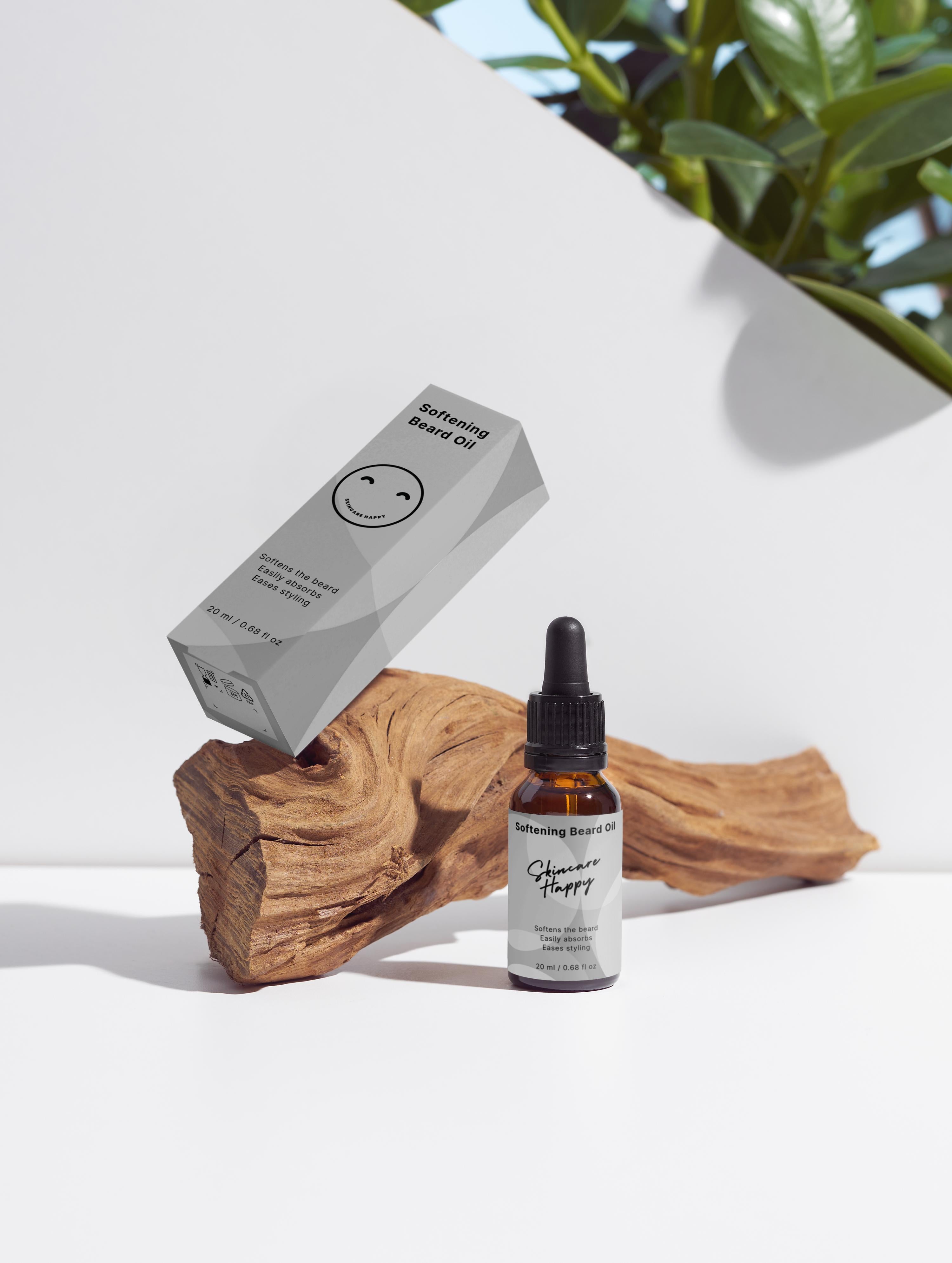Bottle of 'Softening Beard Oil'  with packaging on a wooden block against a white background