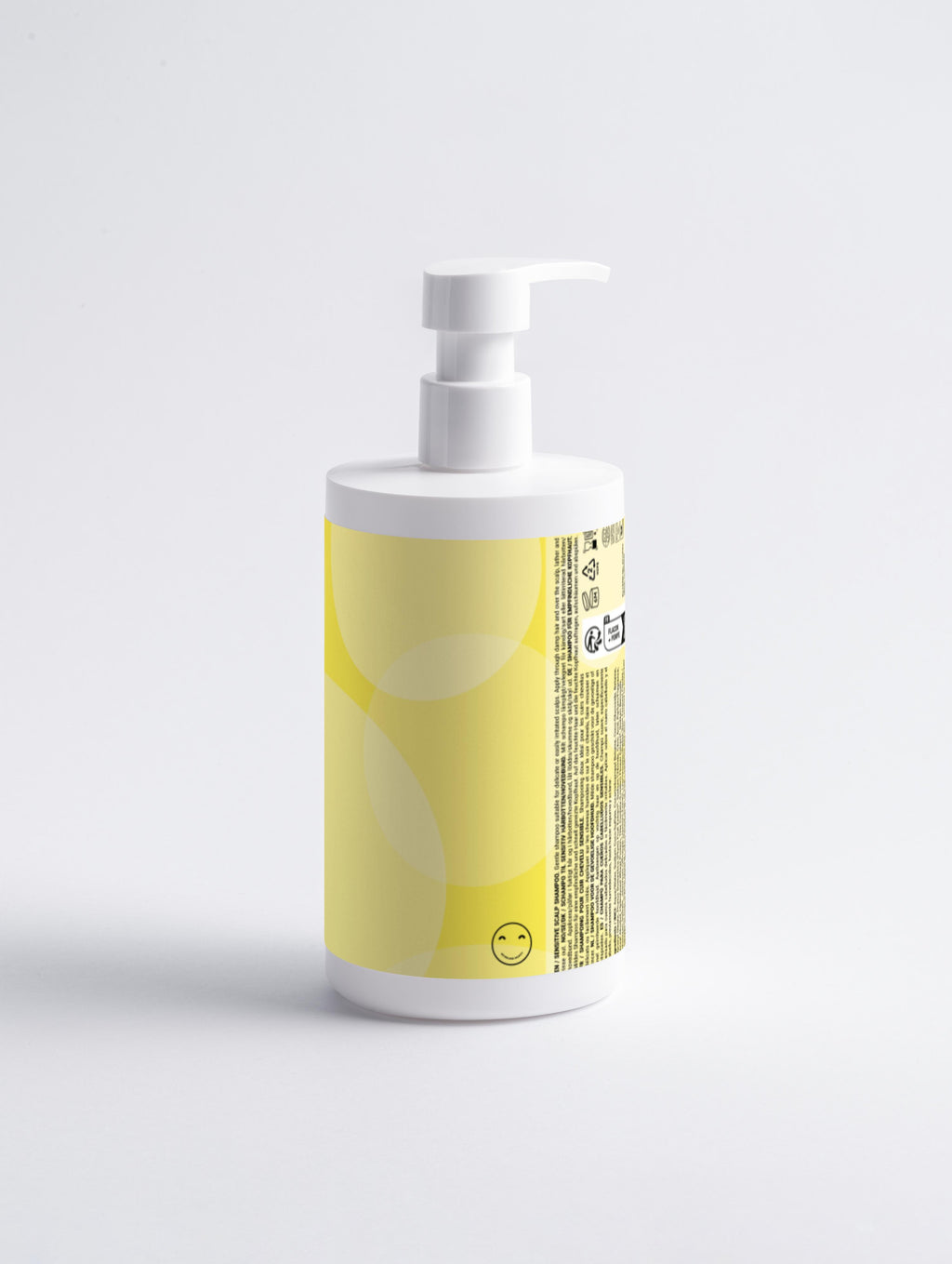 White bottle with a yellow label on a light gray background