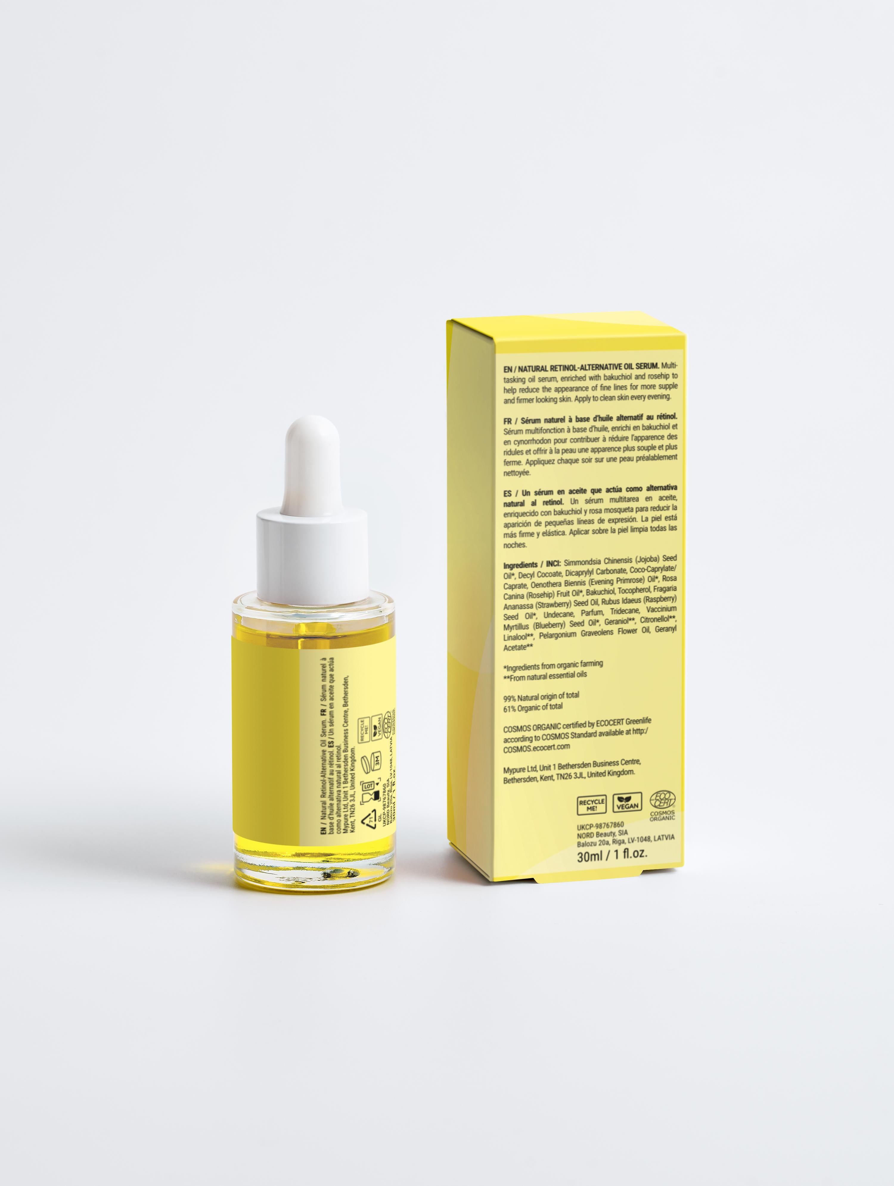 Skincare serum bottle with dropper and its packaging on a light gray background