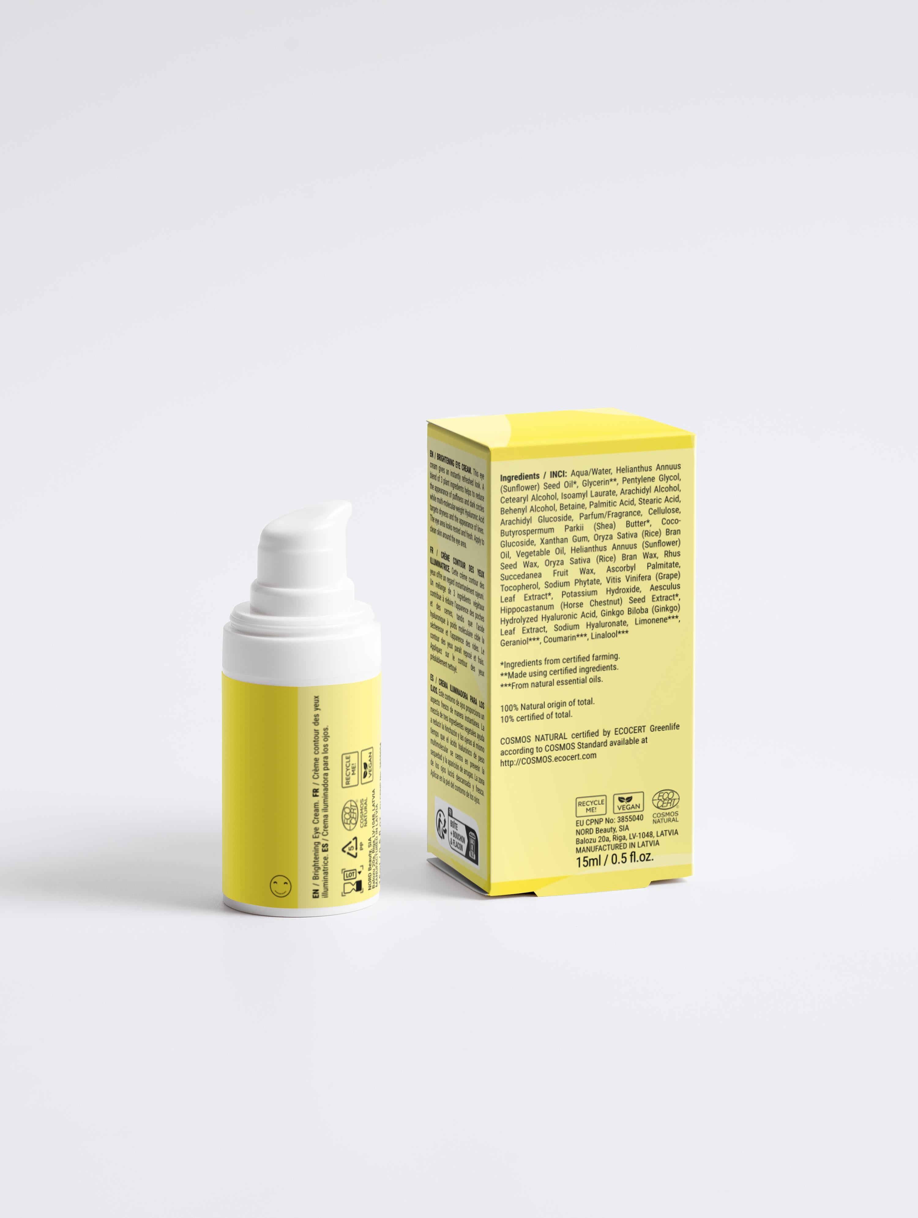 Yellow skincare product bottle and box on a white background
