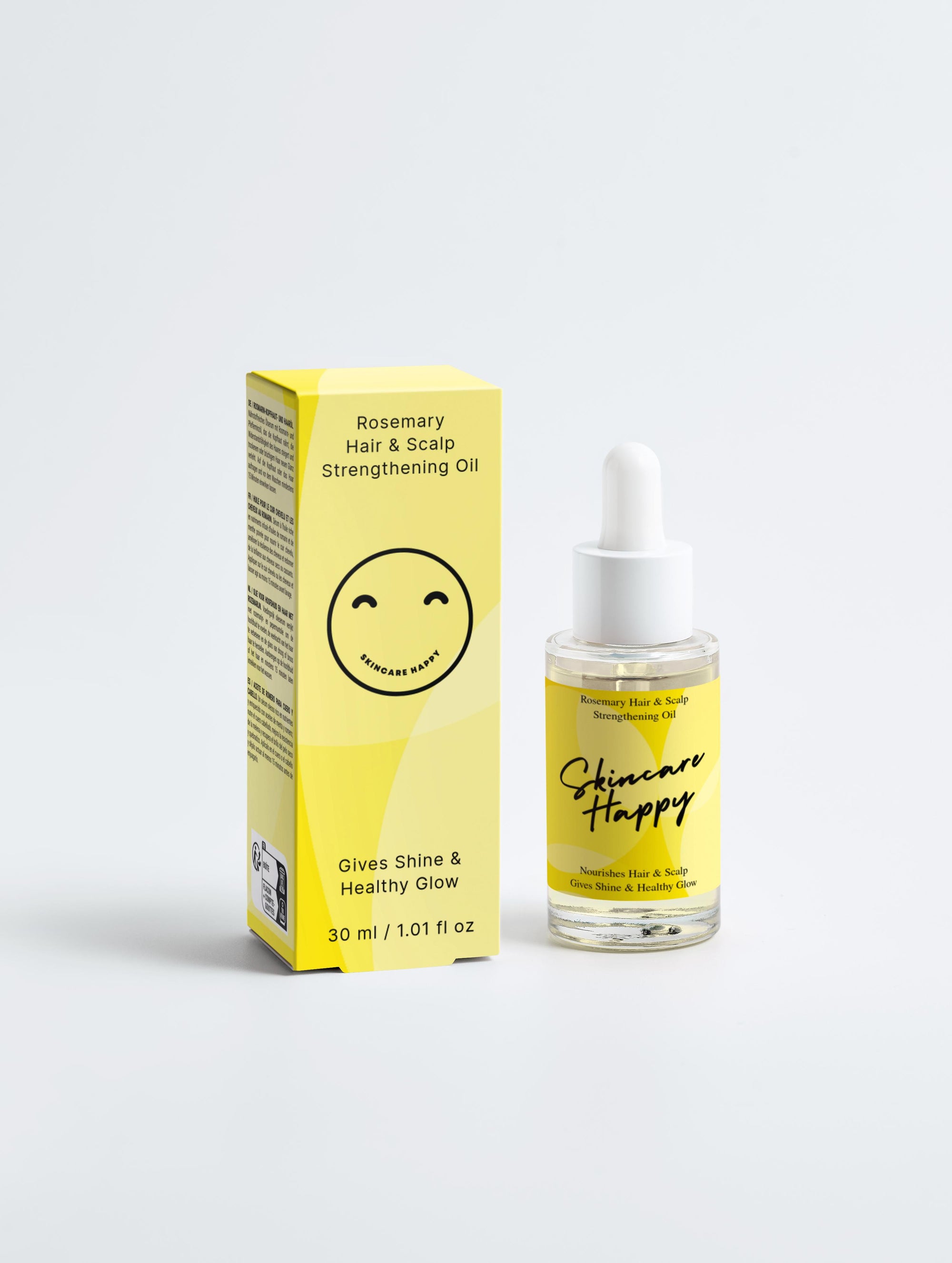 Skincare Happy hair oil bottle and packaging on a white background