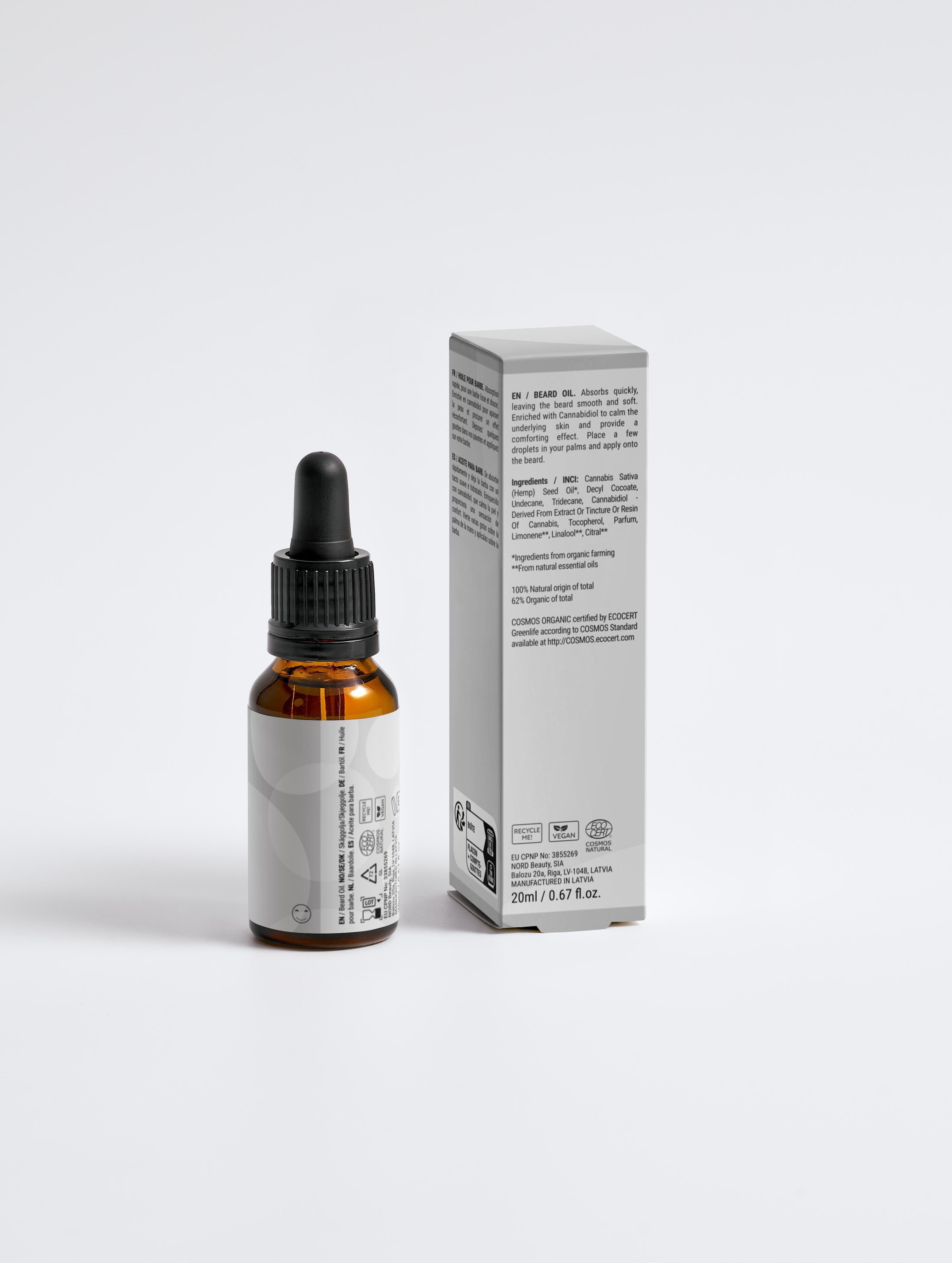Brown dropper bottle with white label next to a white box on a light gray background