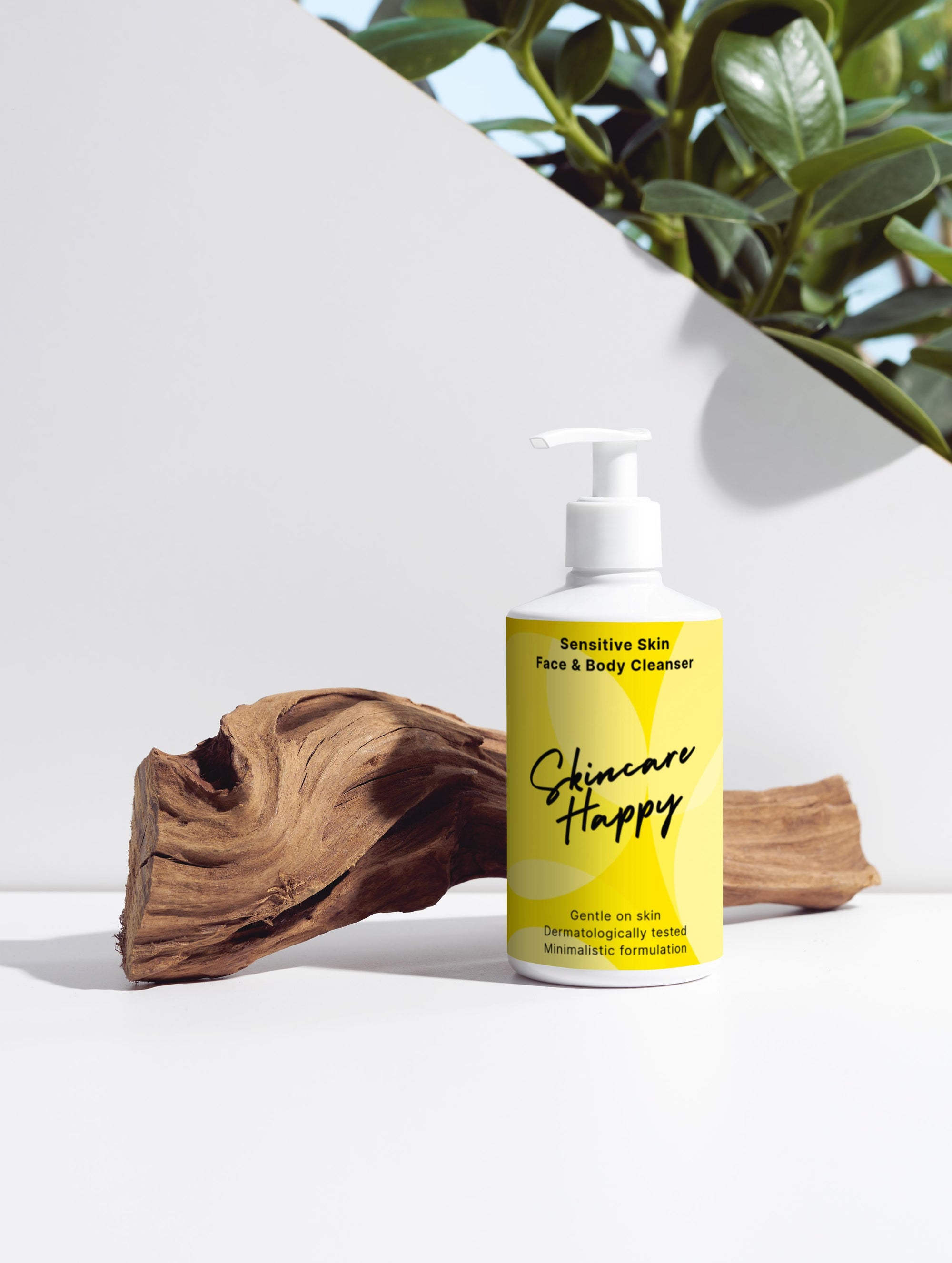 Yellow bottle of 'Skincare Happy' cleanser with a plant and wooden log in the background